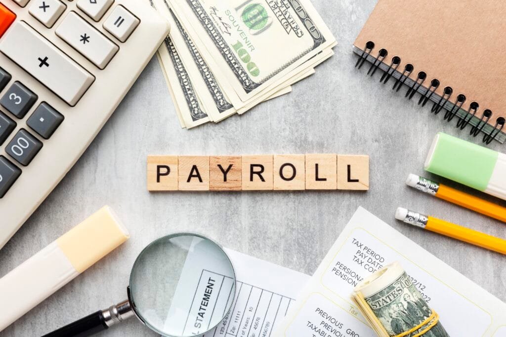 top view payroll concept with items Best Accounting and Tax Consultant in Dubai | Profitrack